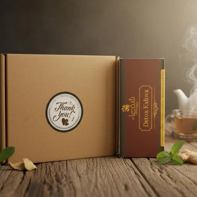 Theshiffaa Detox Kahwa tea box with thank you gift packaging on rustic wooden table